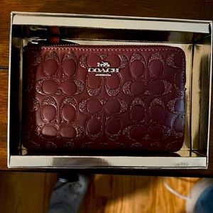 Burgundy coach wristlet